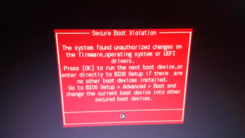 Ошибка безопасная загрузка не включена. Красный экран при включении компьютера. В биосе красный экран. При включение ПК красный экран. Красная надпись при загрузке компьютера.